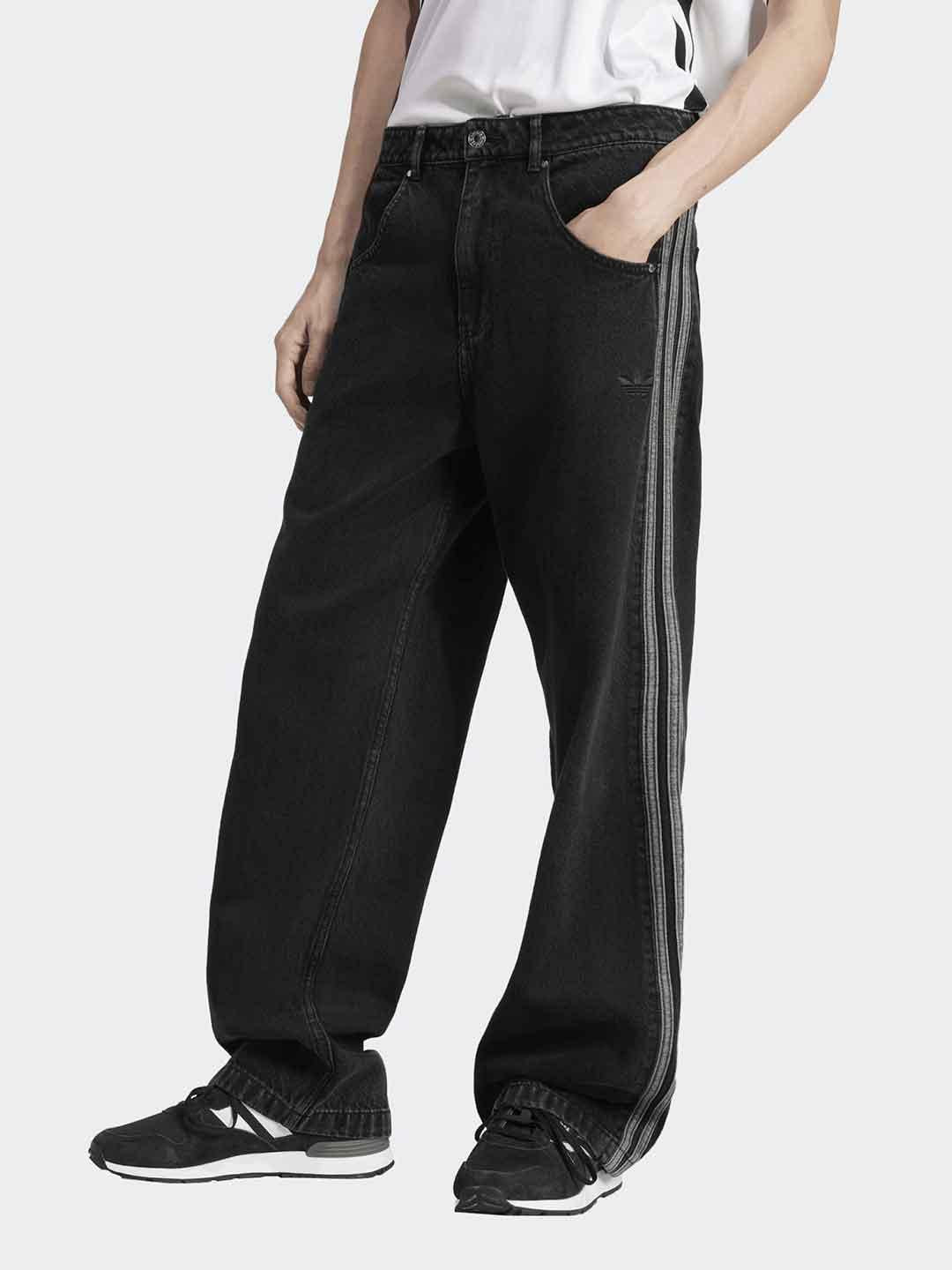 Adidas jeans nero con bande ai lati JC6718 NERO ADIDAS