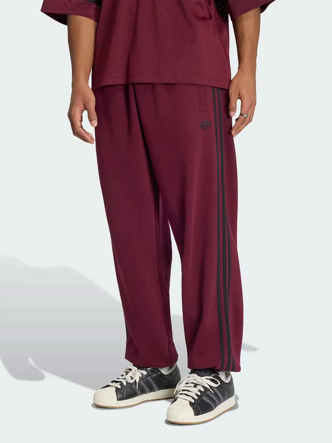 Adidas Adicolor pantalone bordeaux con bande nere KV9277 BORDEAUX ADIDAS 