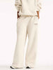 New Balance pantaloni panna con logo bordeaux
