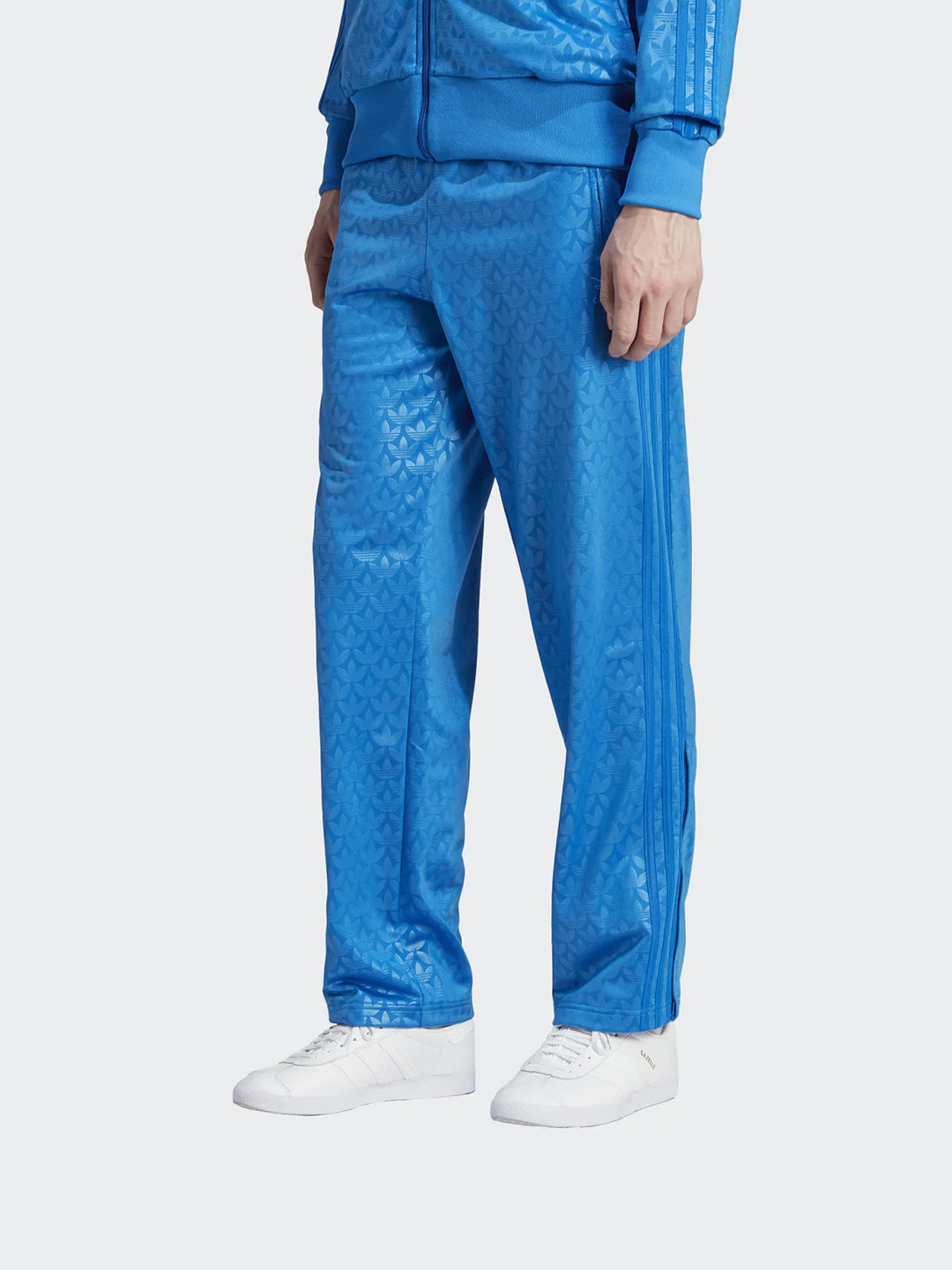 Adidas blue trousers with tone-on-tone allover logo
