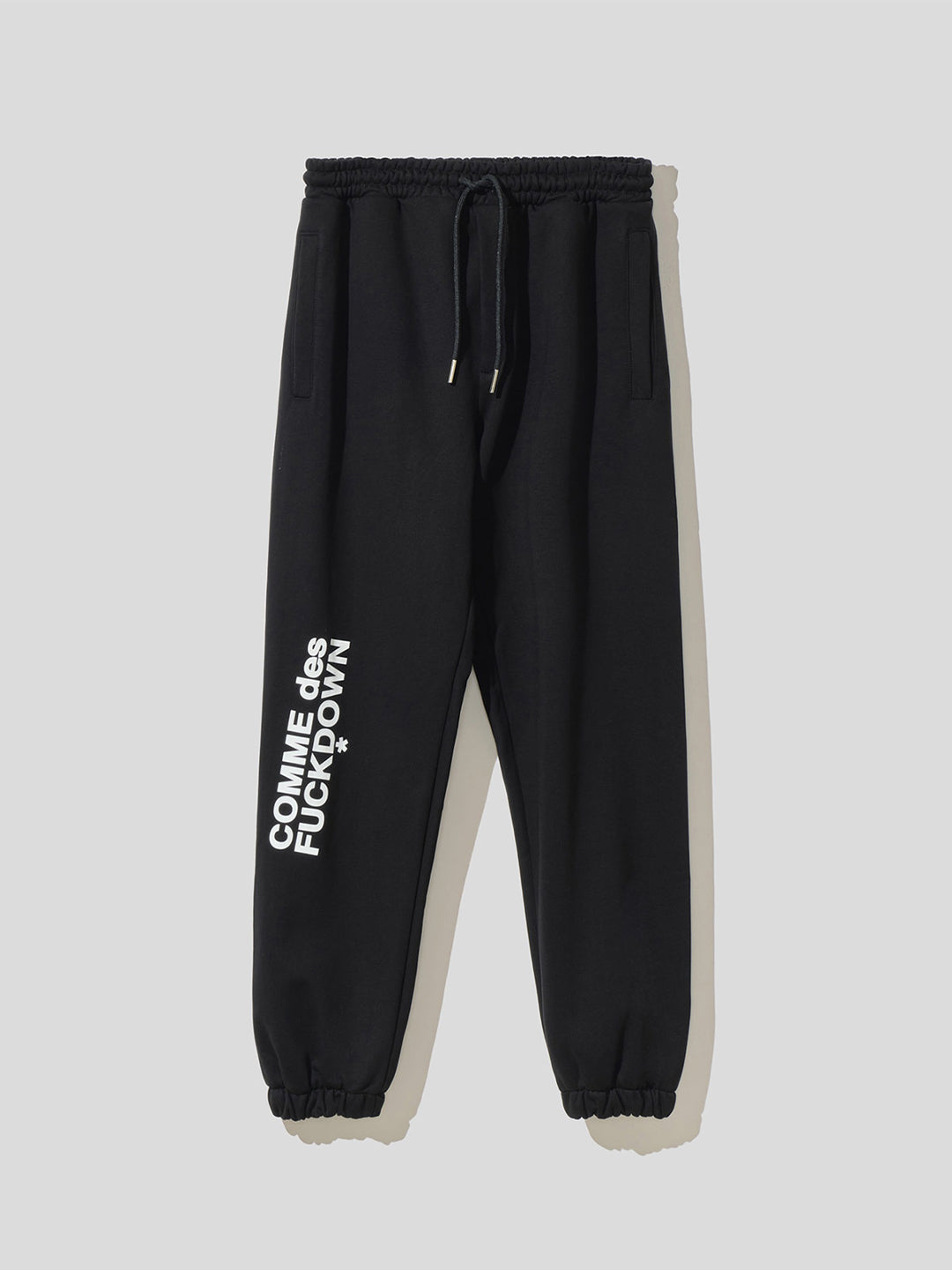 Comme des fuckdown black trousers with contrasting logo