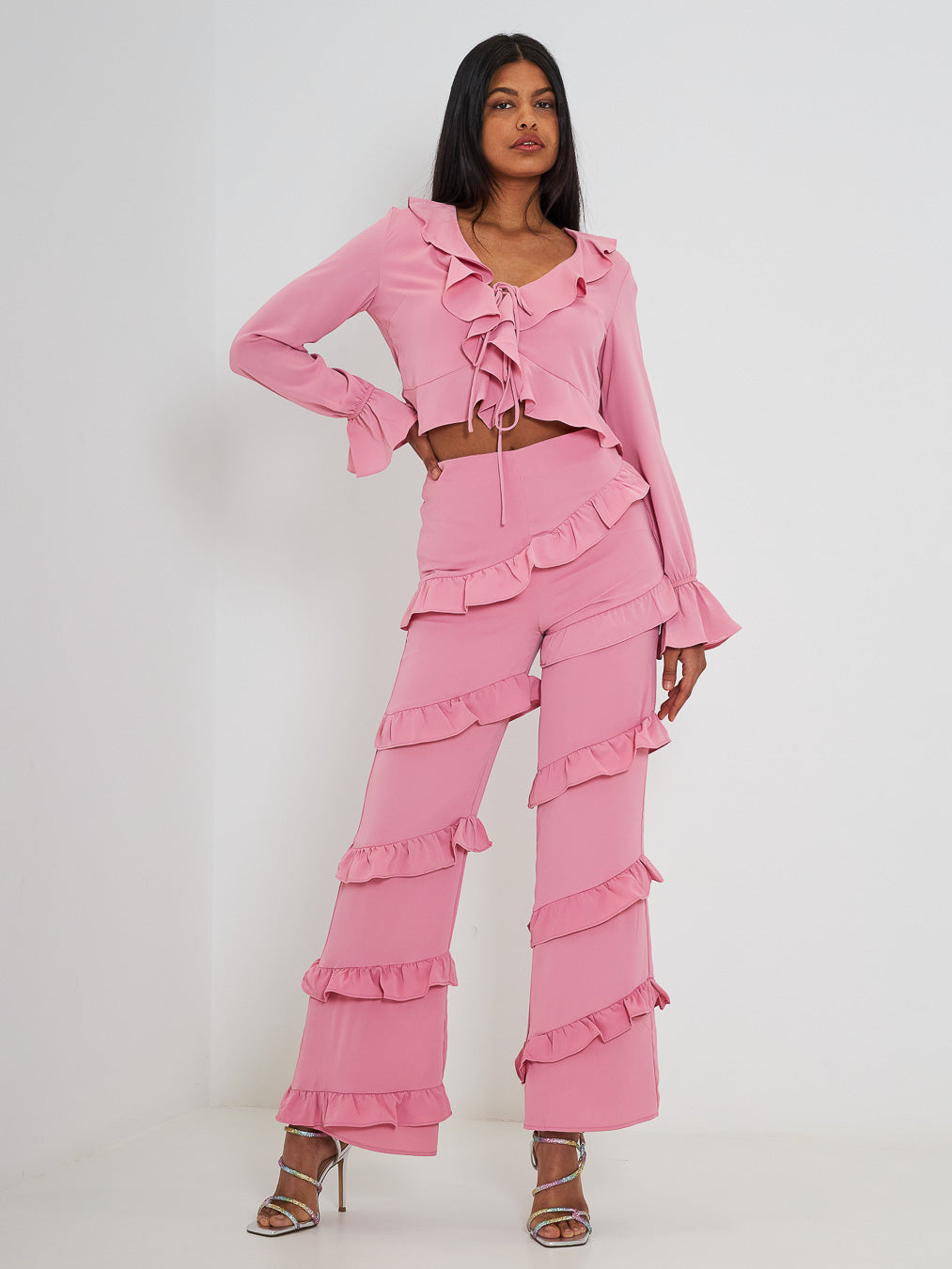 Glamorous coordinated top and trousers with pink ruffles